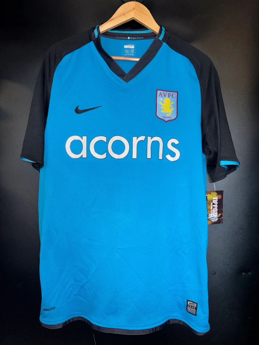 Preços baixos em Nike ASTON Villa International Club Camisas de
