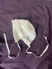 crocheted baby bonnet, pink scalloped trim, satin ribbon tie