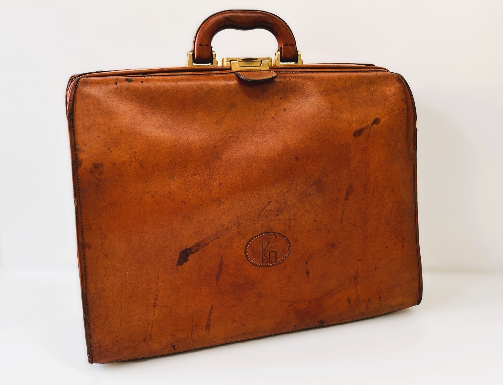 Brown Guidotti leather doctor's bag with top handle and gold hardware