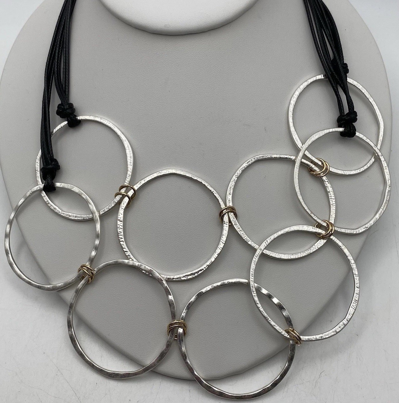 Bold Silver Tone Hammered Interlocking Rings Stat… - image 1