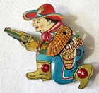 OLD TIN LITHO CHILDS TOY MECHANICAL NOISE CLICKER / SHOOTING COWBOY w/ GUN