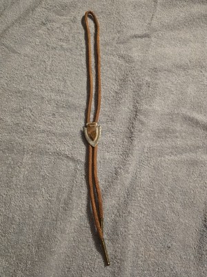 Silver Tone Bolo arrowhead shape with  brown stone with metal ends,cloth cord