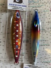 Two 200 Gram Jigs With Glow and Holographics