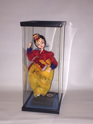 korean dolls in glass case