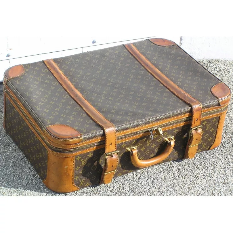 Lot - A VINTAGE LOUIS VUITTON SOFTSIDED SUITCASE, AMERICAN, 1970s