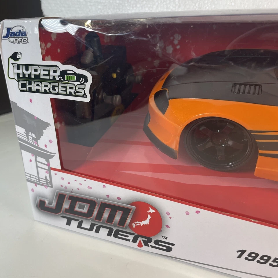 Jada Toys JDM Tuners 1995 Toyota Supra R/C coche escala 1:16 naranja negro NUEVO Foto 3 de 4