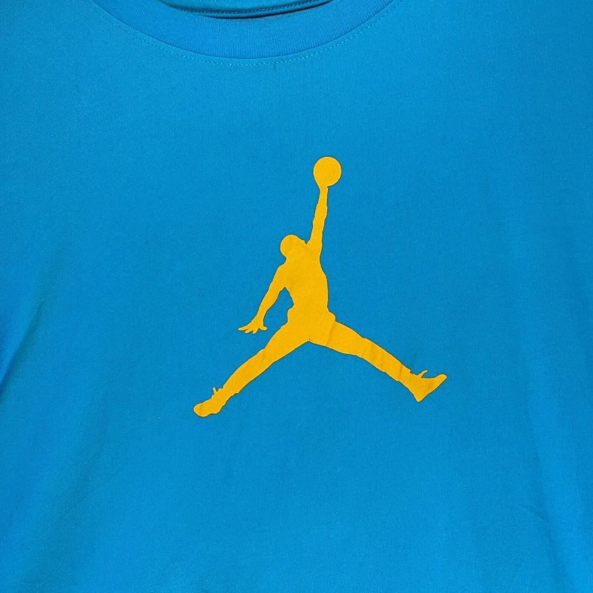 blue and yellow jordan shirt