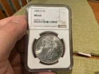 1885-O Morgan Silver Dollar Bright White NGC MS63 Looks Better