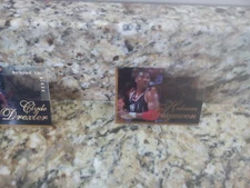 1997 INKCREDIBLE INK CREDIBLE BEHIND THE GLASS SCOREBOARD HAKEEM OLAJUWON +125 A