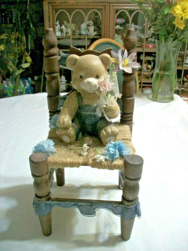 Bear Sitting on a Wooden Chair 