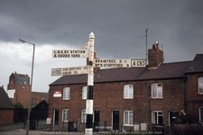 Original colour slide – Dunmow sign post with railway text