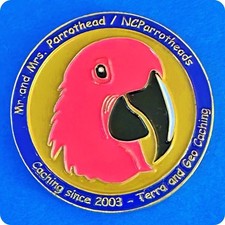 Geocoin NCParrotheads Pink Macaw Foothills Geocachers Ant. Gold Non-Trackable
