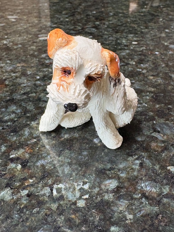 Brown and White Jack Russell figurine scratching it's ear