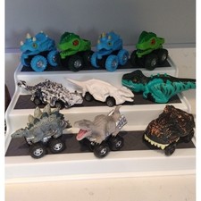 Lot of assorted Dinosaurs and Dino-head toy vehicles