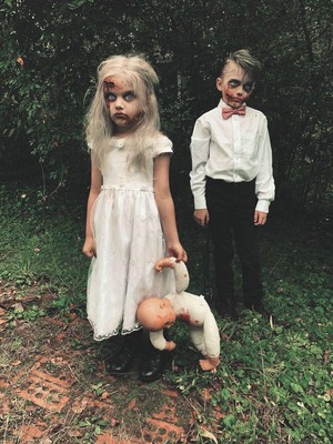 POSTCARD: Vintage Strange Creepy Photo 4x6 girl and a boy with a doll