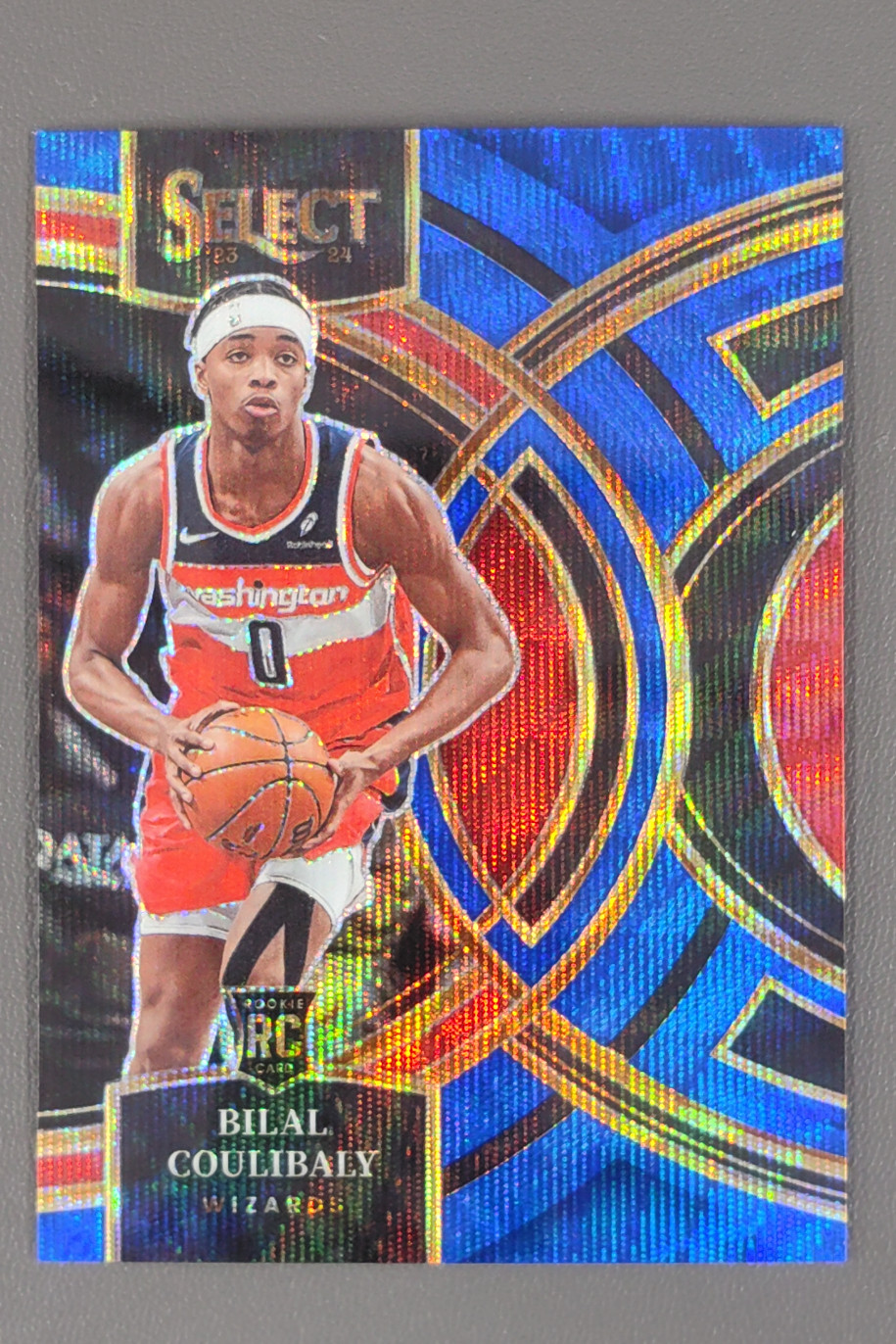 2023-24 Panini Select Bilal Coulibaly Premier Level Blue Wave Prizms RC /75