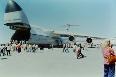 Vintage Found Slide Photo 1970s Crowd gathers around large aircraft on sunny day