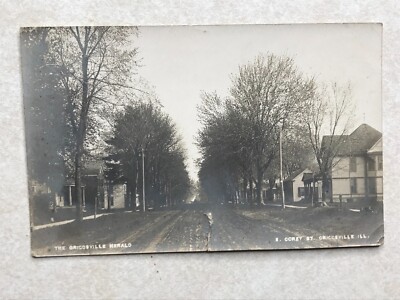 L727 Postcard RPPC Corey Street scene Griggsville IL Illinois Pike co-small tear