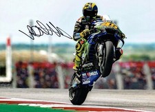 (428)   x3 valentino rossi signed a4 photographs motoGP (REPRINTS)