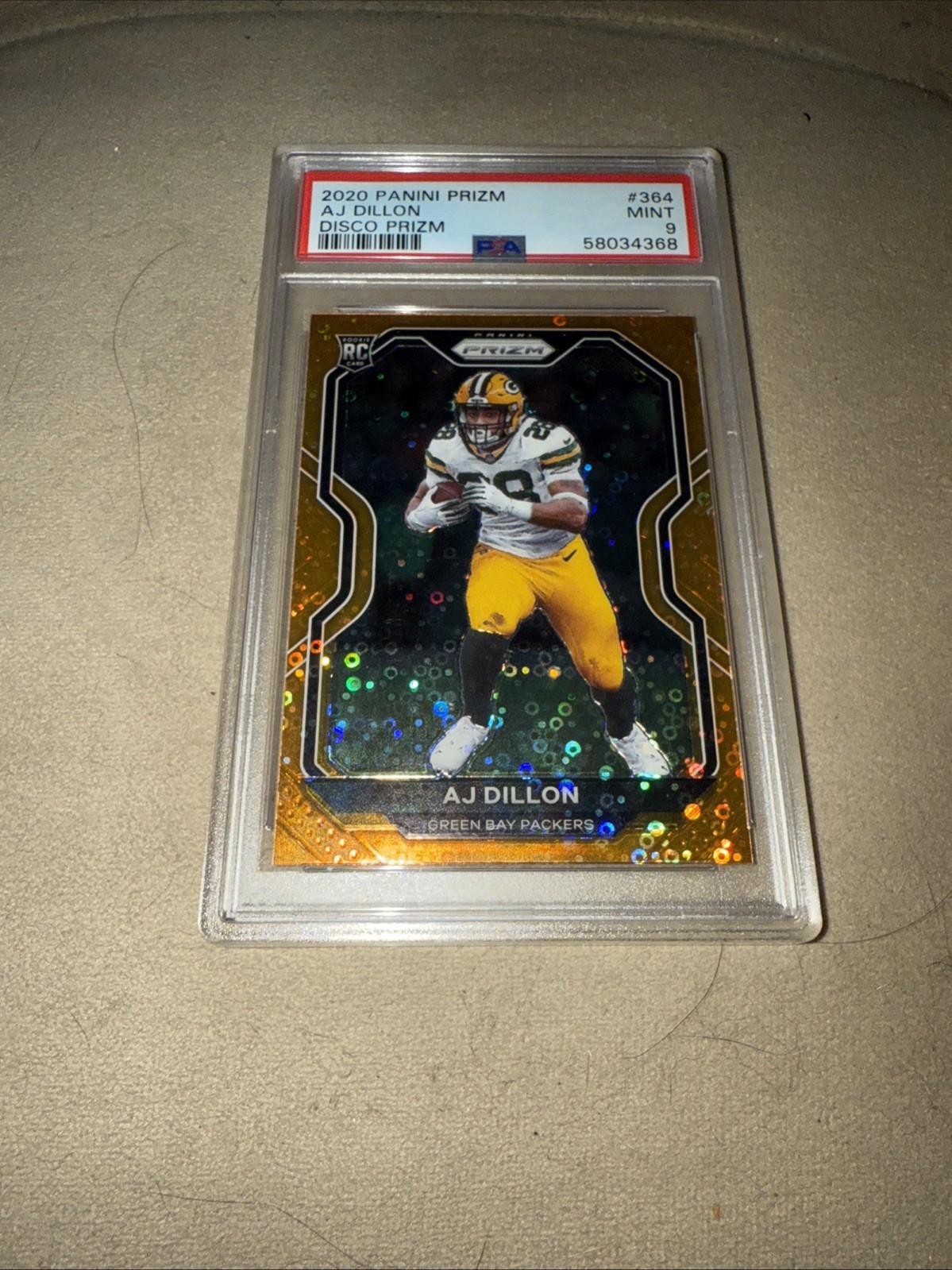 2020 Panini Prizm - Rookie Orange Disco Prizm #364 AJ Dillon (RC) PSA 9