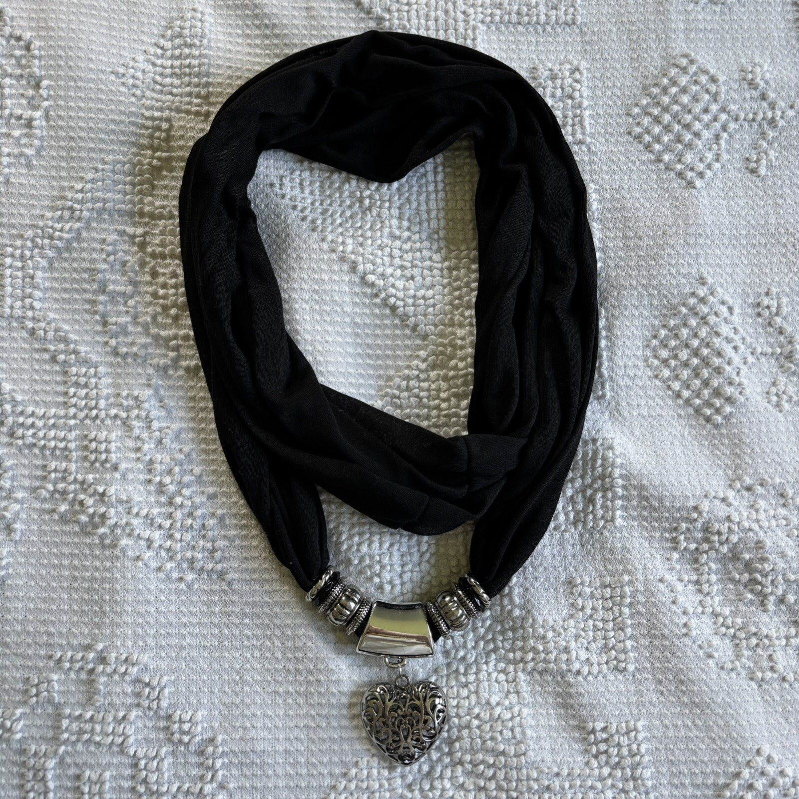 Black circle infinity loop scarf with hanging heart charm
