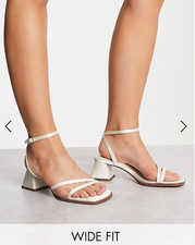 White heeled strappy sandals