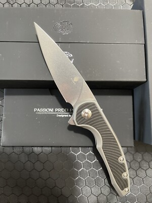 Kizer Knives - Ginesis - Titanium and Carbon Fiber Scales w/ a S35VN Blade.