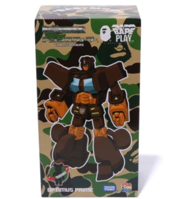 BE@RBRICK × TRANSFORMERS BABY MILO 400％ Daily Prime - Bearbrick Baby Milo & Camo Shark Optimus Prime