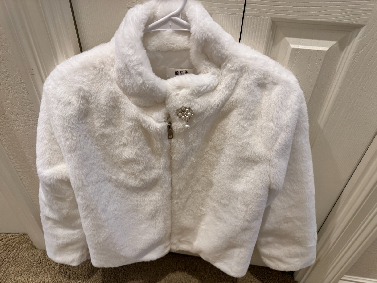 Beautiful white faux fur jacket with rhinestone clip