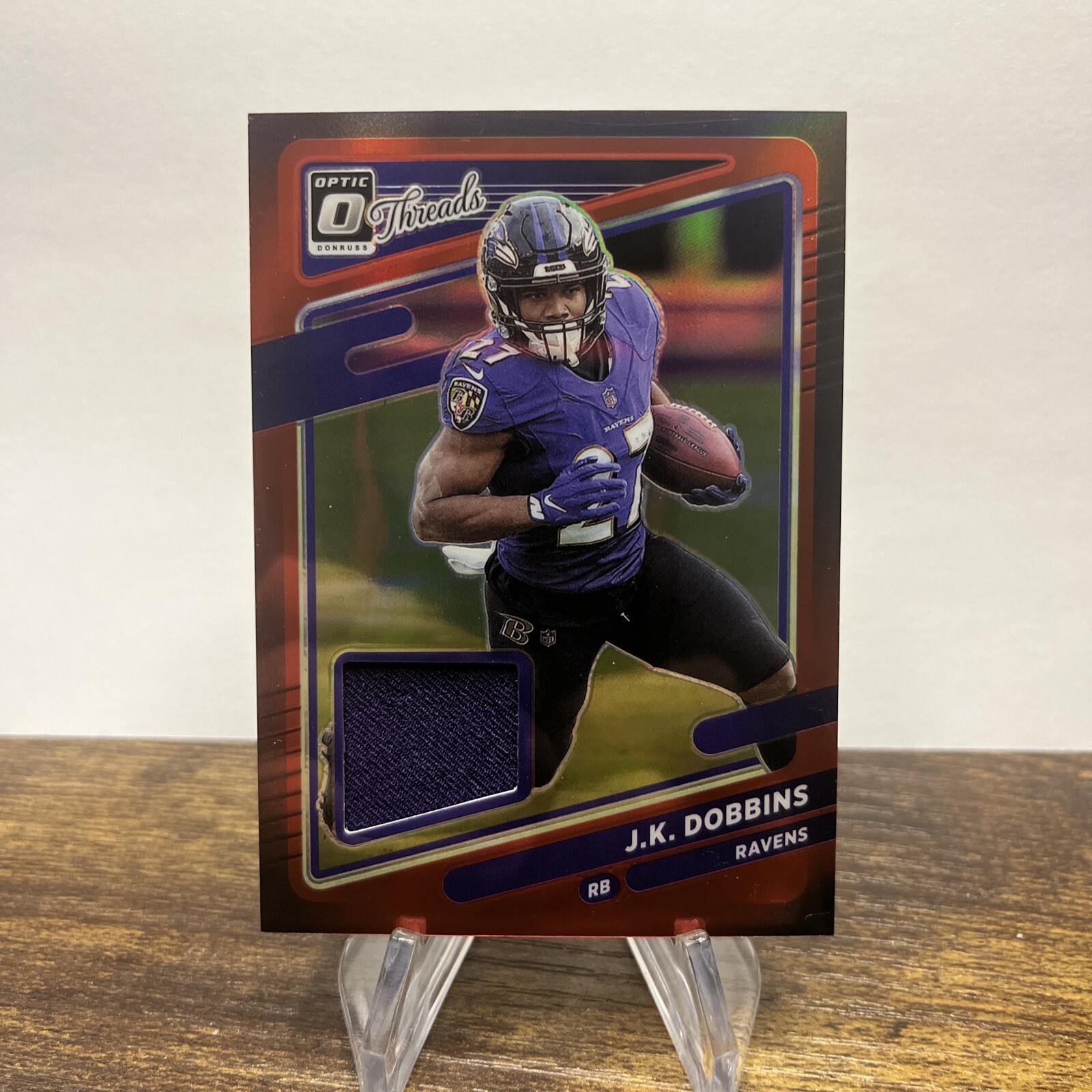 2021 Panini Donruss Optic JK Dobbins Threads Red Prizm Jersey TH6