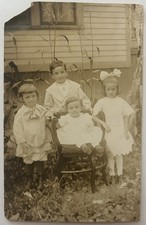 RPPC Photo Postcard 4 Children Siblings in Ya...