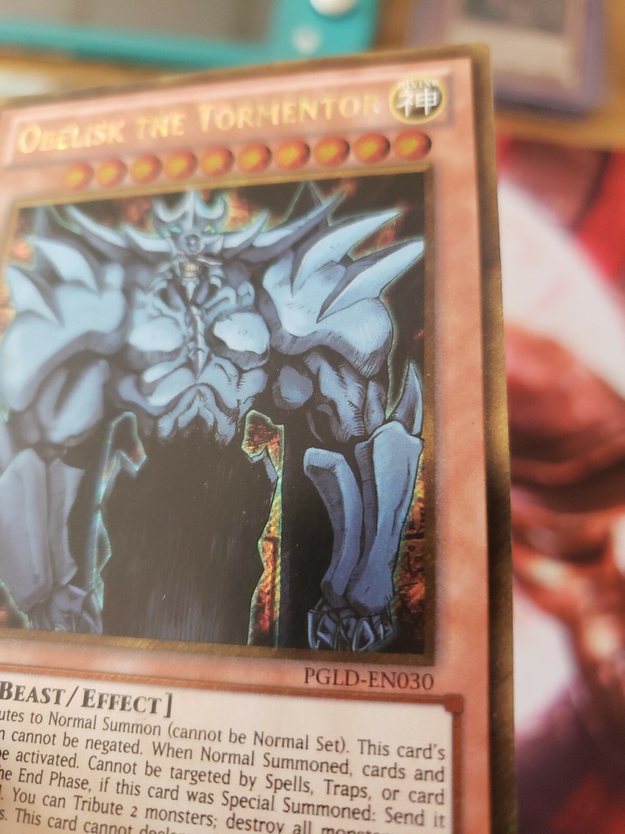 obelisk the tormentor gold pokemon card Amazon.com: Yu-Gi-Oh! - Obelisk The Tormentor - MVPC-EN001 - Gold Super  Rare (Misprint) main image 1