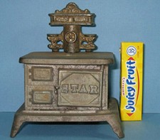 AUTHENTIC  OLD SMALL CAST IRON TOY STOVE "STAR" W/ BACK PIECE ON SALE CI375
