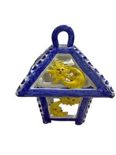 Applique in ottone decapato con ceramica traforata.