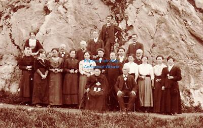 Photo postcard civilians in front of rock wall probably room or from Aulendorf