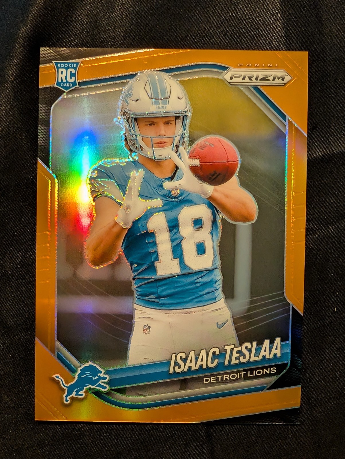 2025 Panini Prizm - Rookies Isaac Teslaa #316 Orange Prizm /249 (RC)