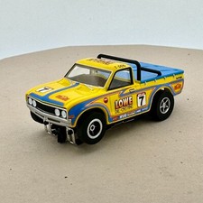 Auto World '75 Datsun 620 Pickup, Yellow 7, X-Traction Chassis, New Loose