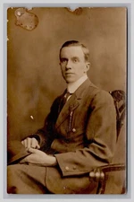 Postcard: RPPC Well Dressed Man Sitting In Studio, Lipp Studios - Unposted
