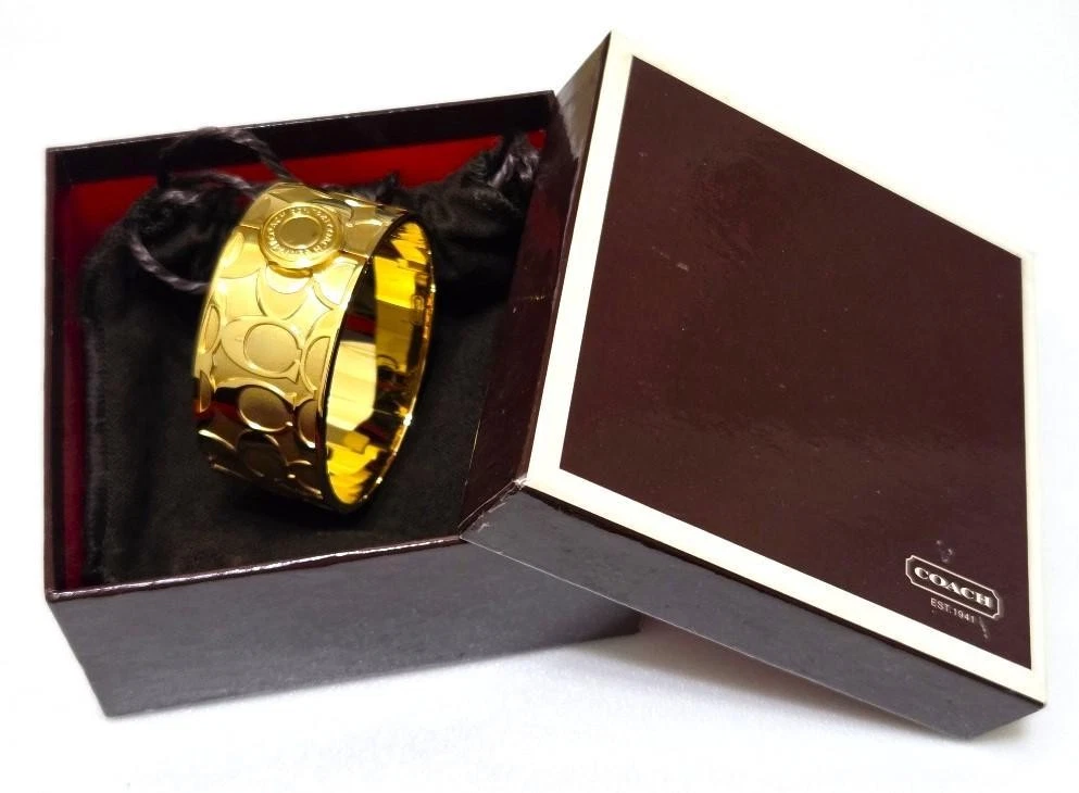 Bracciale COACH colore oro con scatola autentico