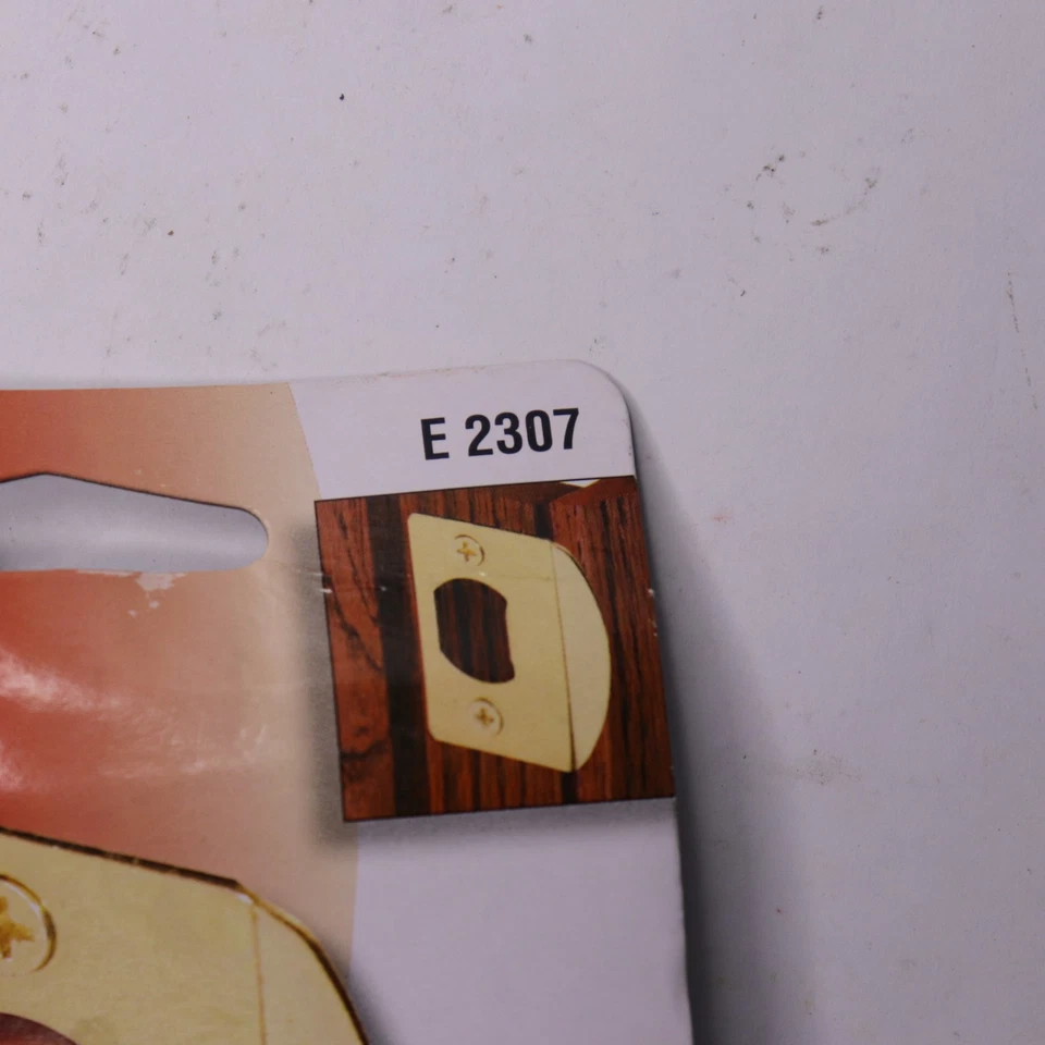 Cerradura de puerta estándar de seguridad Defender placa de golpe residencial latón E 2307 Foto 2 de 4