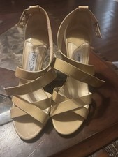 These are Jimmy Choo "Vamp" Nude Patent Leather Platform Sandals.