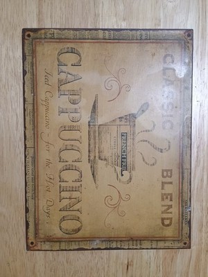 rustic metal tin wall sign featuring a ''Cappuccino Classic Blend'' coffee theme