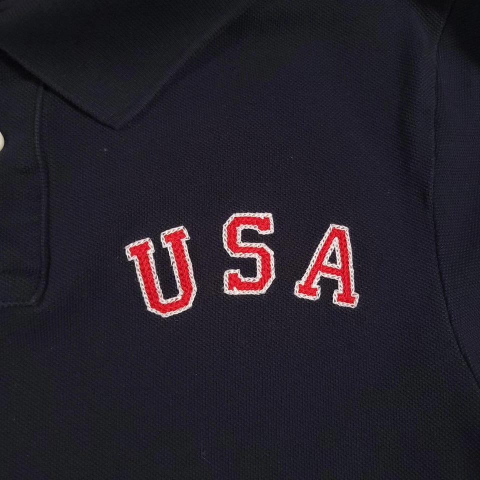 Camisa Polo EE. UU. Para Hombres Pequeña Nike Atletismo Bandera Americana XVIII Juegos Olímpicos Foto 4 de 4