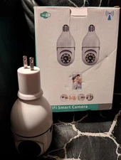 2 WIFI Smart Camera With Audio & Light For Light Socket Or Wall Plug  Open box