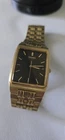 Vintage Seiko Quartz Men Tank Watch 7N33-5A09 Gold Tone Black Day Date 28mm