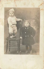 Siblings Portrait Girl And Infant Standing On Chair 1910s RPPC Postcard