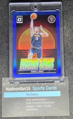 Nikola Jokic 2024-25 Panini Donruss Optic Rising Suns #7 Blue Prizm 8/49 Denver