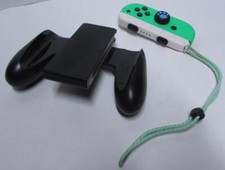 Official Nintendo Switch black grip, strap, right green joy con controller