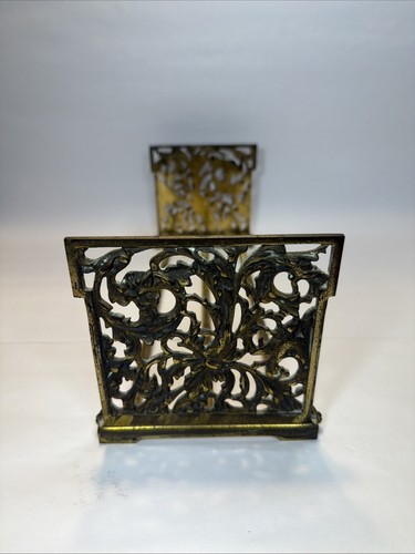 Vintage brass tone metal expandable folding book rack Devil faces & birds