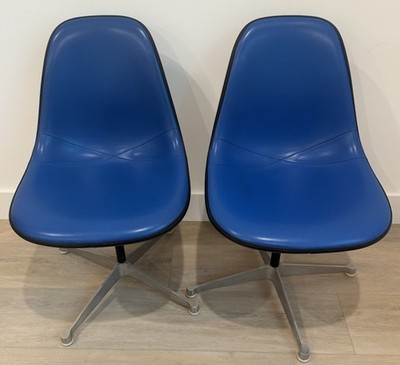 Pair of Herman Miller Swivel Blue Naugahyde Molded Fiberglass Eames Shell Chairs